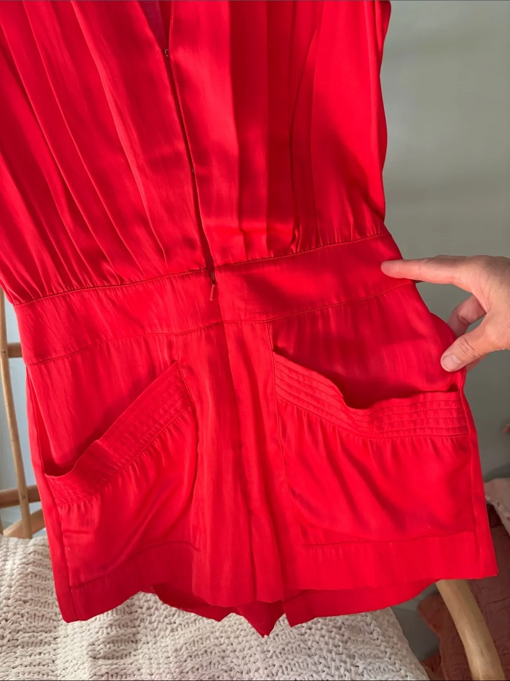 Beautiful Bebe satin vibrant red/orange romper with gold accents.